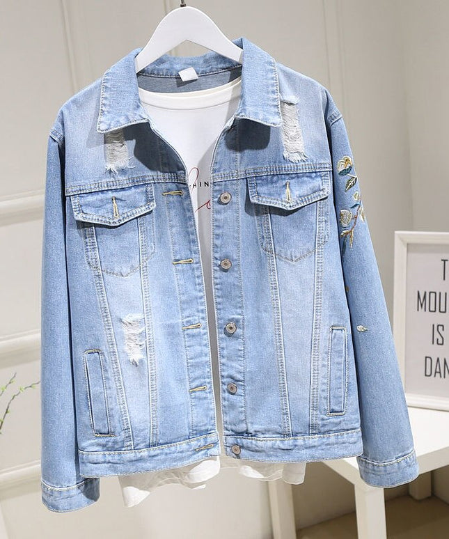 Damska kurtka jeansowa z haftem na plecach i przetarciami