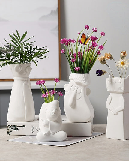 Wazon ceramiczny z motywem twarzy biały