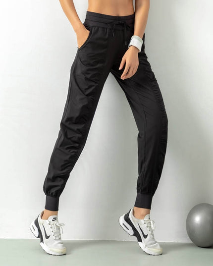 Damskie sportowe spodnie materiałowe z wiązaniem