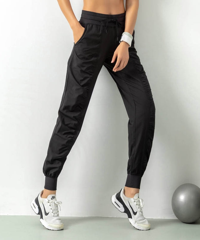 Damskie sportowe spodnie materiałowe z wiązaniem