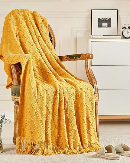 Koc z frędzlami i fakturą w romby