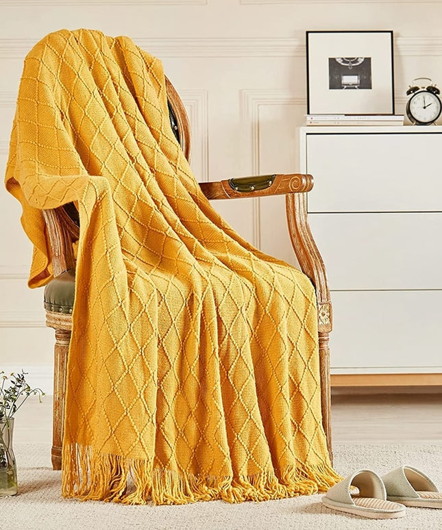 Koc z frędzlami i fakturą w romby