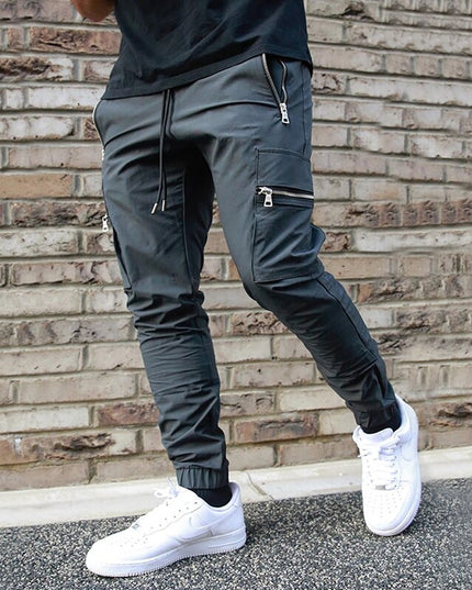 Męskie spodnie bojówki z kieszeniami na suwak