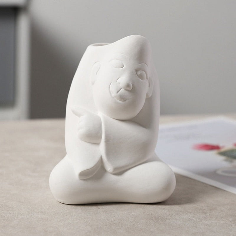 Wazon ceramiczny z motywem twarzy biały