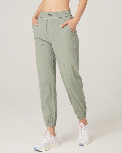 Damskie sportowe spodnie materiałowe z wiązaniem