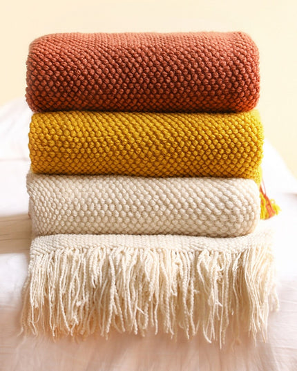 Dzianinowy koc z plecioną fakturą