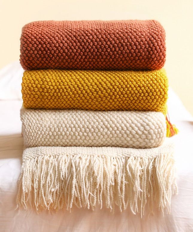 Dzianinowy koc z plecioną fakturą