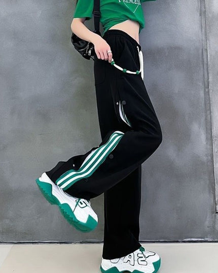 Damskie spodnie dresowe rozpinane po bokach