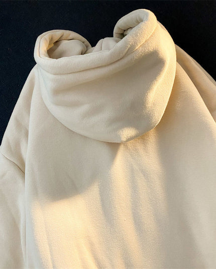 Damska bluza zapinana na zamek z naszywanym napisem