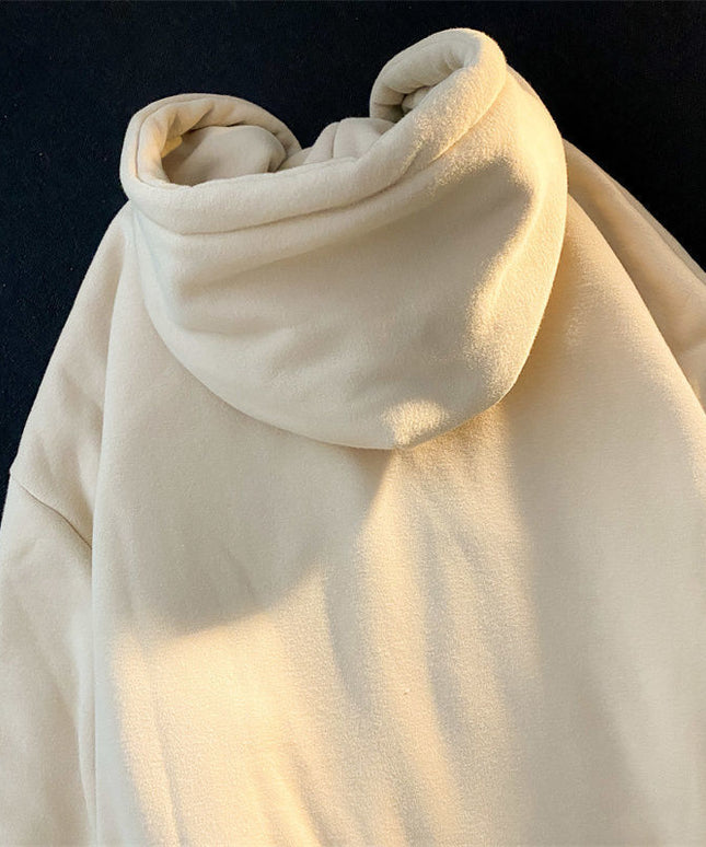 Damska bluza zapinana na zamek z naszywanym napisem