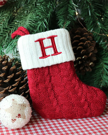 Świąteczna ozdoba wisząca w postaci skarpety z literą H