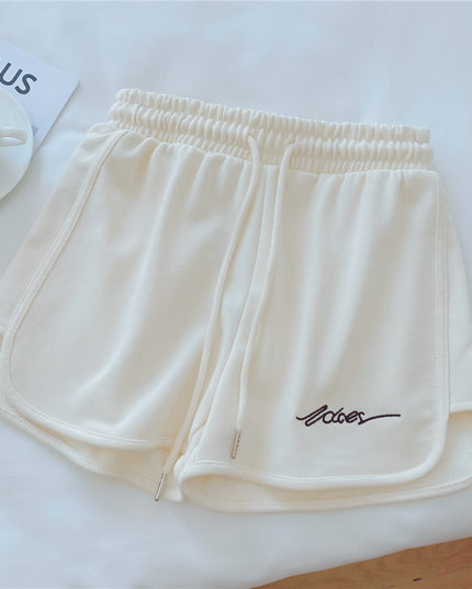 Damskie szorty sportowe z wyszywanym napisem