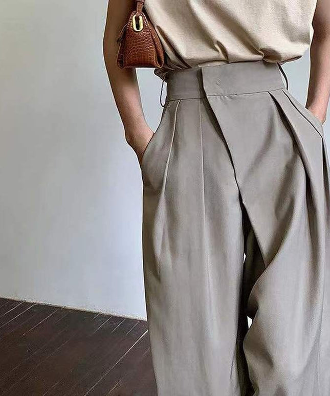 Damskie spodnie chinosy z szerokimi nogawkami i asymetrycznym zamkiem