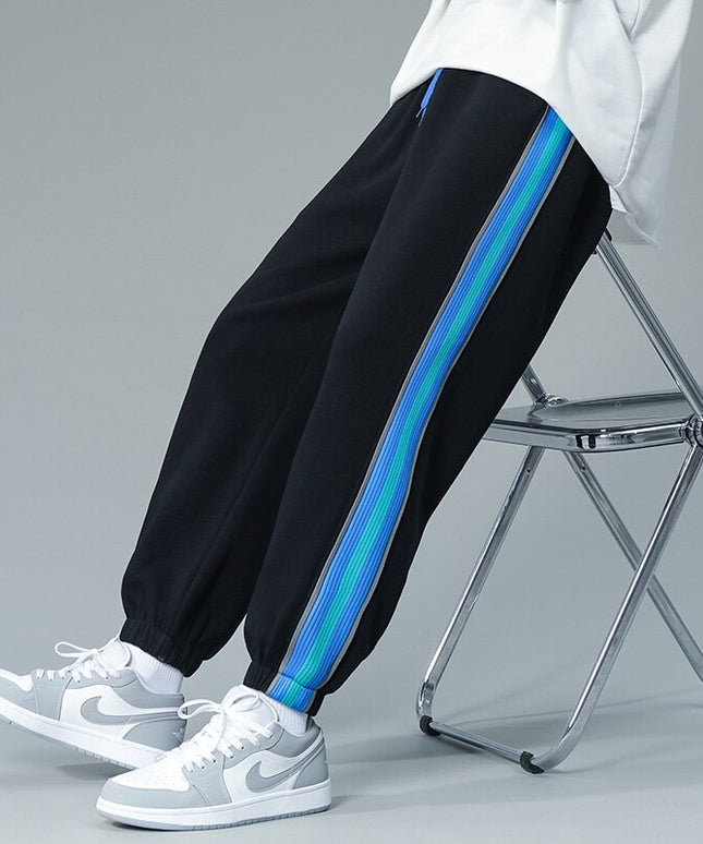 Męskie spodnie treningowe z niebieską lamówką