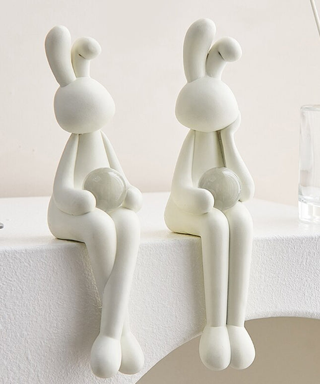 Figurka dekoracyjna królik siedzący w jasnych kolorach