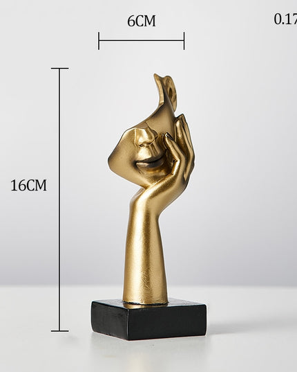 Figurka dekoracyjna twarz w złotych kolorach