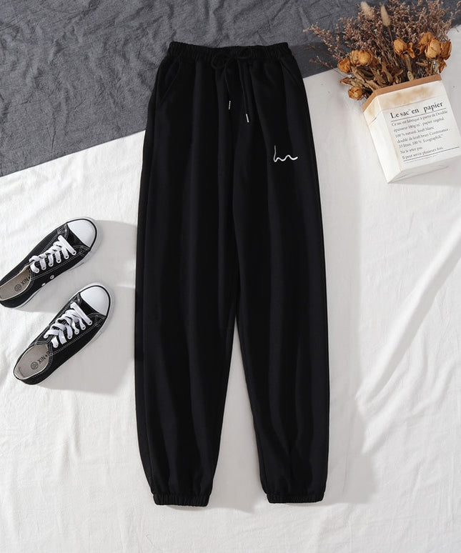 Damskie spodnie dresowe z naszywką i wysokim stanem