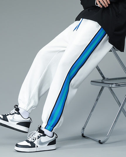 Męskie spodnie treningowe z niebieską lamówką