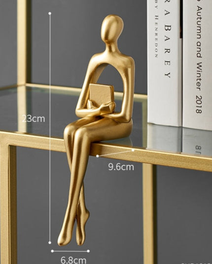 Figurka dekoracyjna postać w złotych kolorach z wycięciem