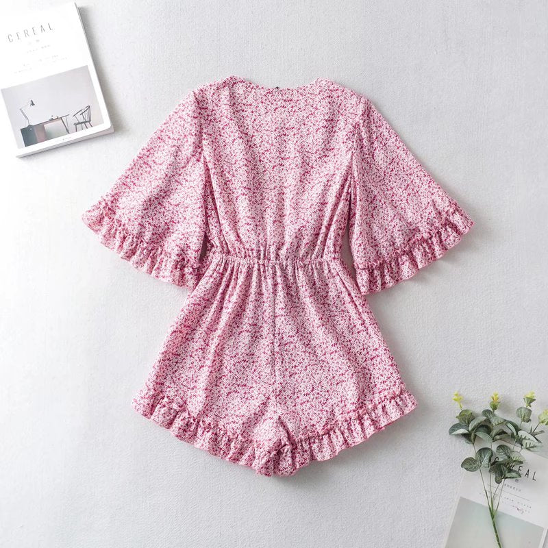 Damski kombinezon w stokrotki z szerokimi rękawami