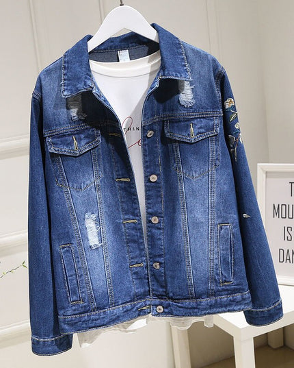 Damska kurtka jeansowa z haftem na plecach i przetarciami