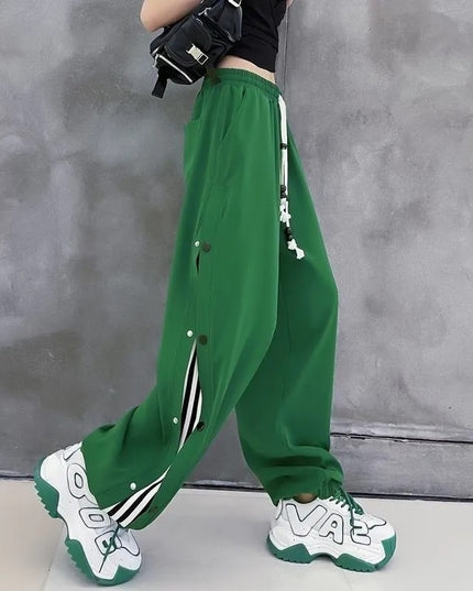 Damskie spodnie dresowe rozpinane po bokach