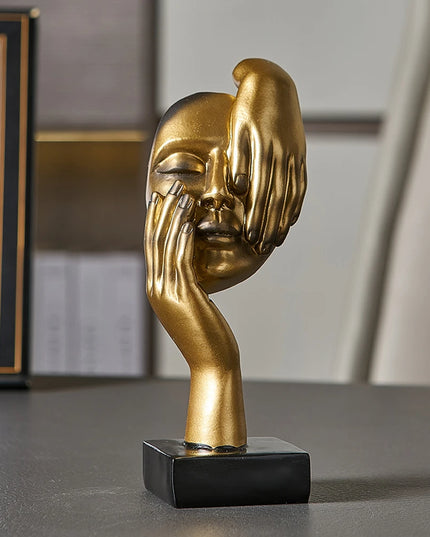 Figurka dekoracyjna twarz w złotych kolorach