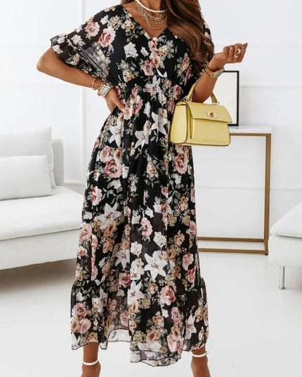 Sukienka midi w kwiatki z podkreśloną talią